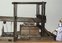 Maquette fonctionnelle au 1/10e d'un des deuxensembles d'un pressoir double.